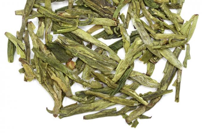 Bagged Fermented organic dragon well tea with very distinctive shape